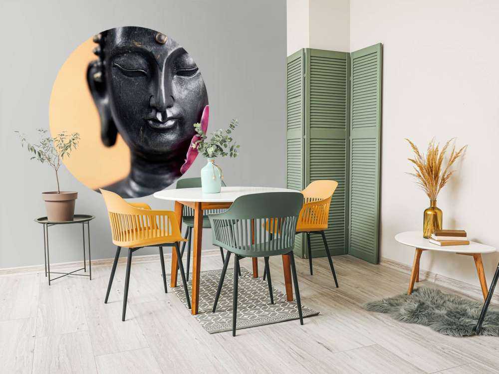 Buddha und rosa Orchidee