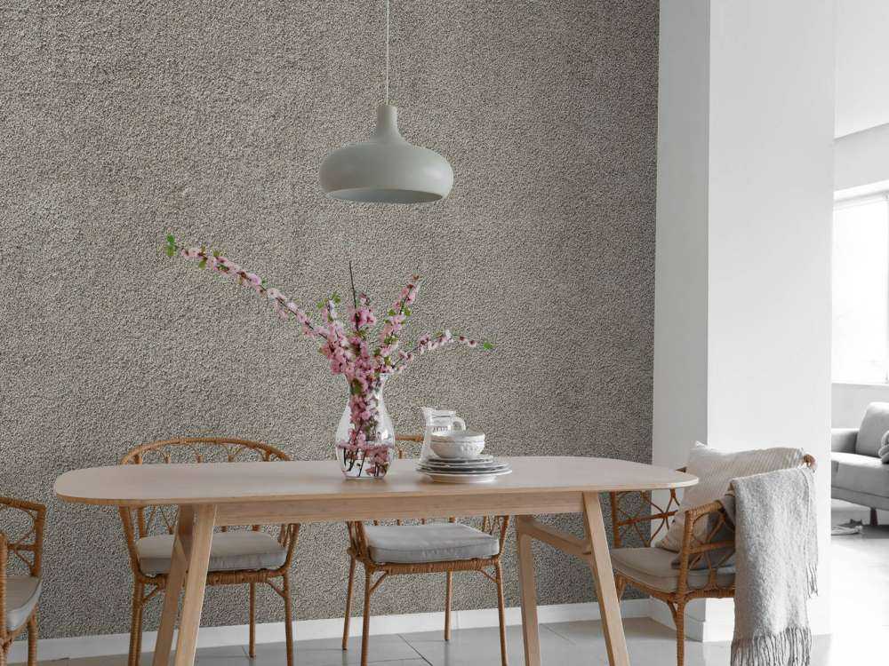 Betonmauer mit feinen Steinen