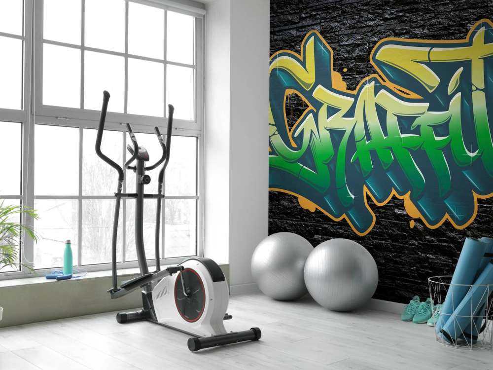 Graffiti auf Wand aus schwarzen Steinen