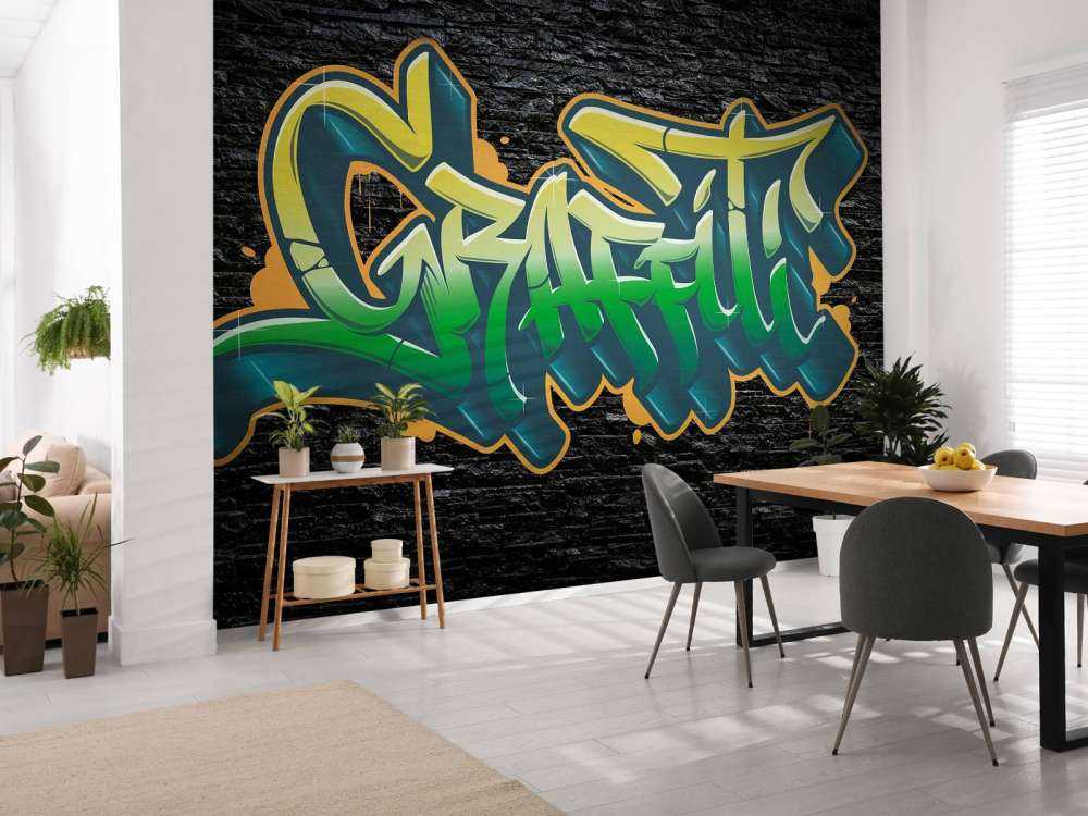 Graffiti auf Wand aus schwarzen Steinen