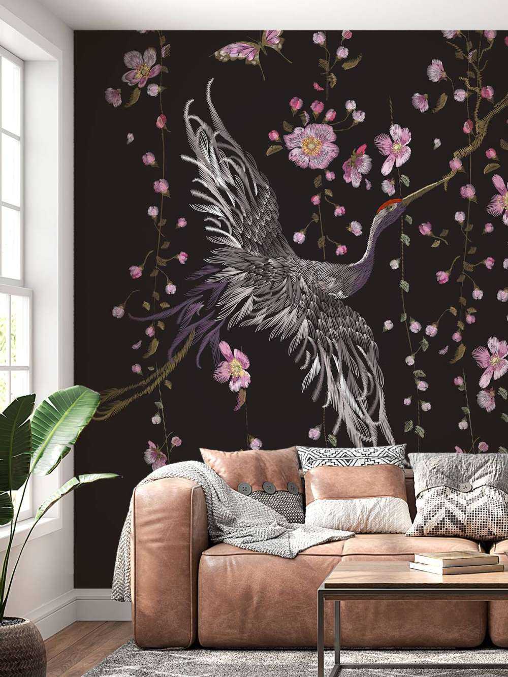 Kraniche mit rosa Blumen