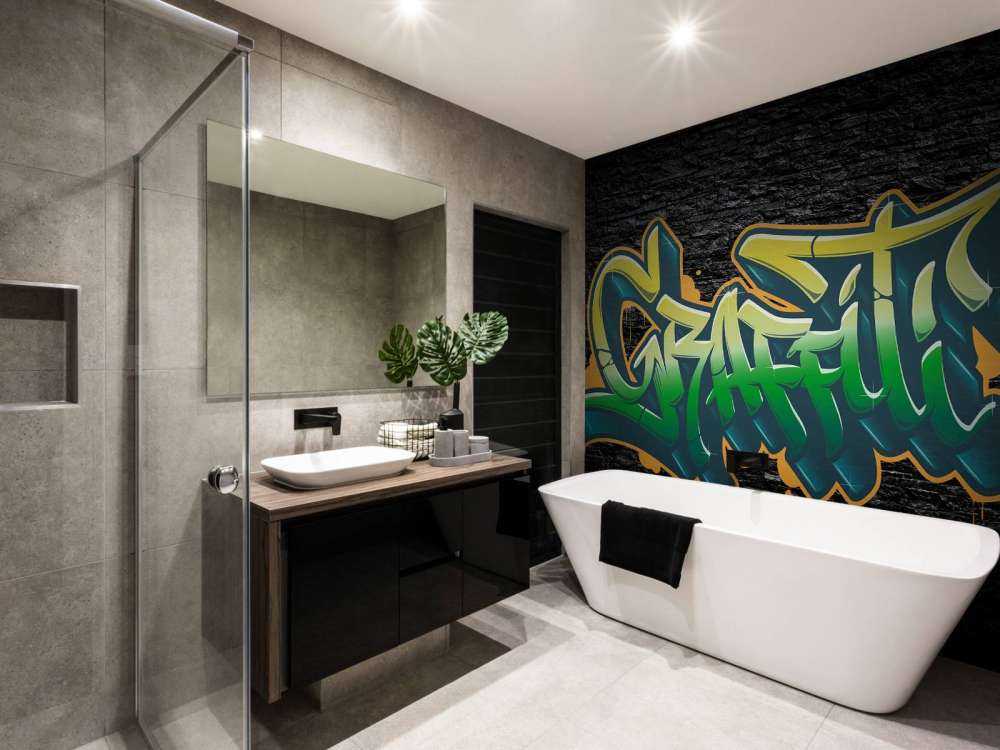 Graffiti auf Wand aus schwarzen Steinen