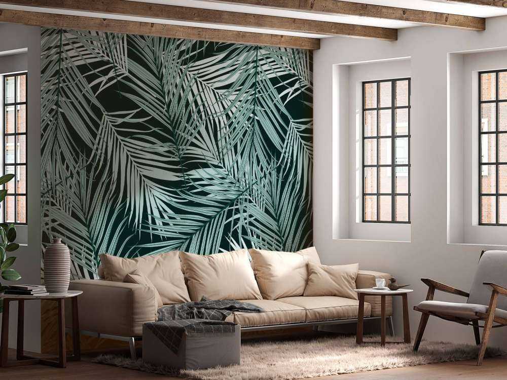 Tropische Blätter auf schwarzem Hintergrund