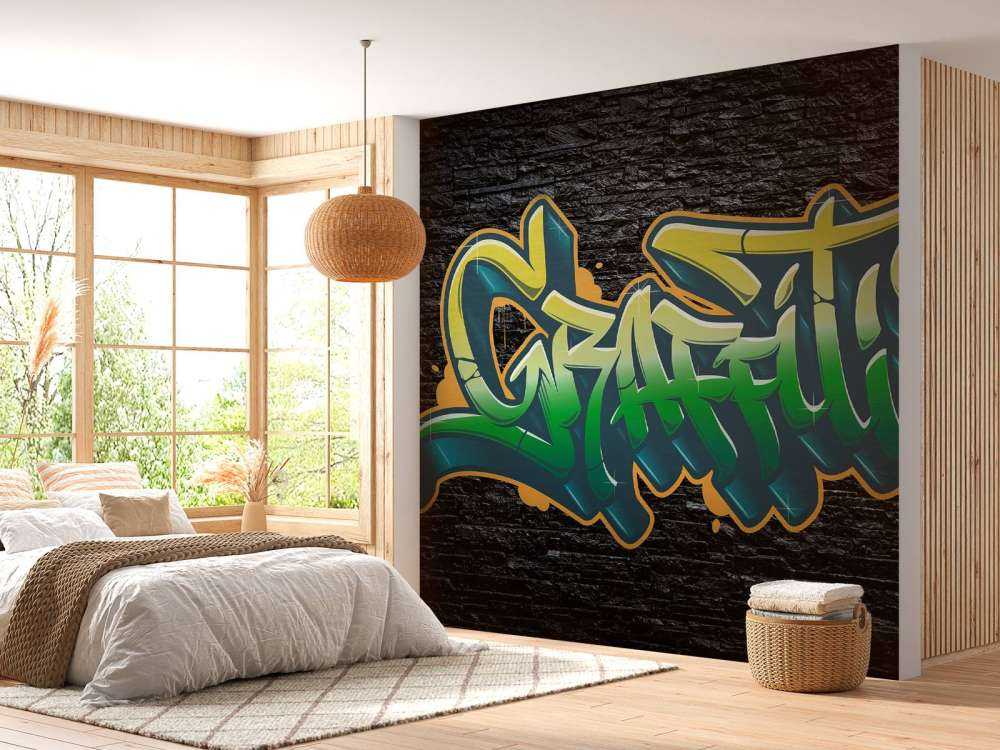 Graffiti auf Wand aus schwarzen Steinen