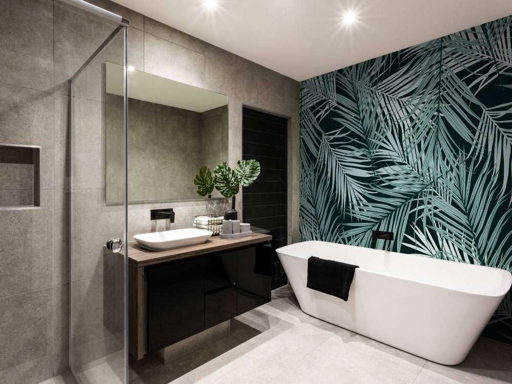 Tropische Blätter auf schwarzem Hintergrund