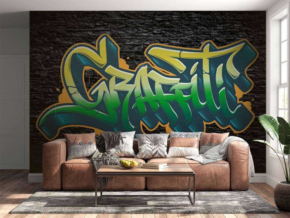 Graffiti auf Wand aus schwarzen Steinen