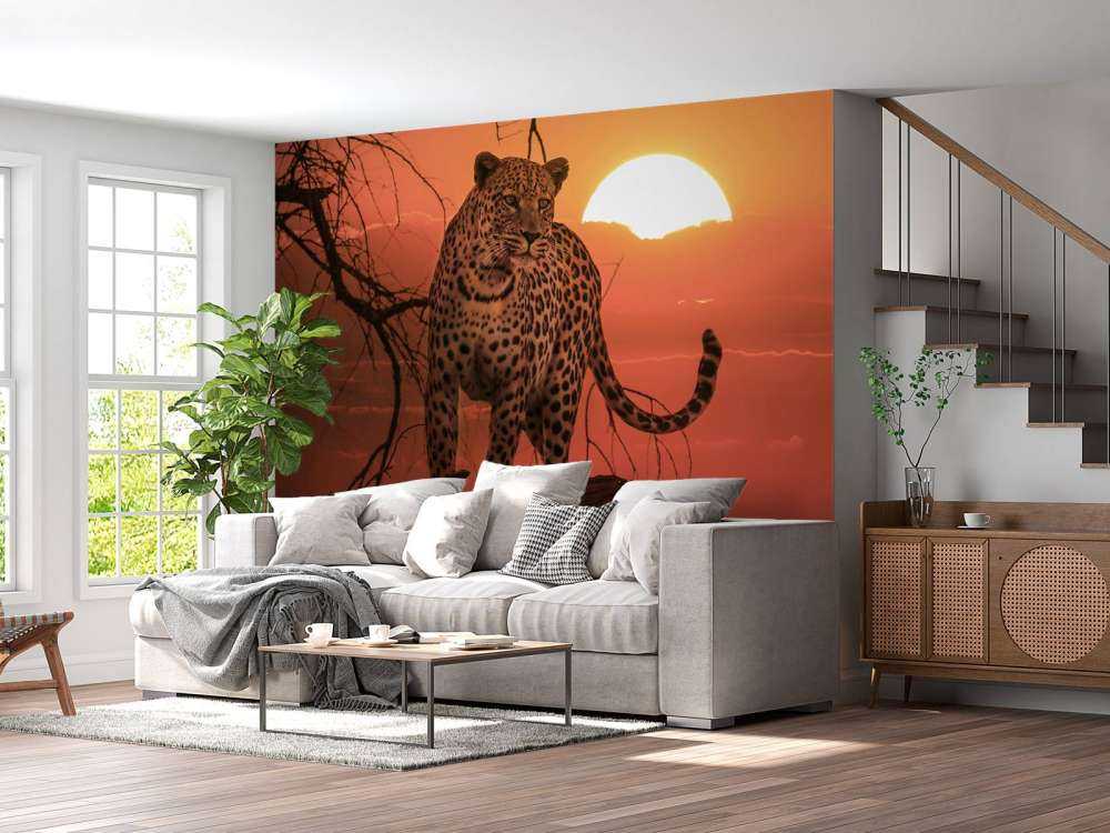 Leopard mit untergehender Sonne