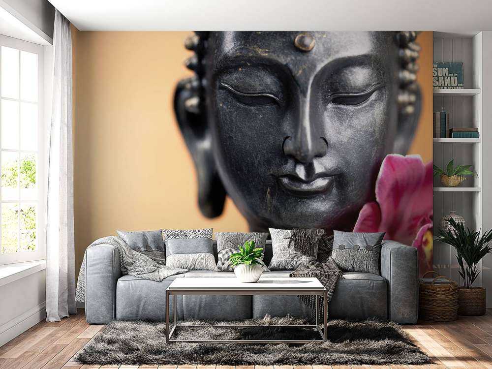 Buddha und rosa Orchidee