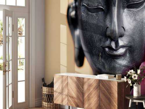 Buddha und rosa Orchidee