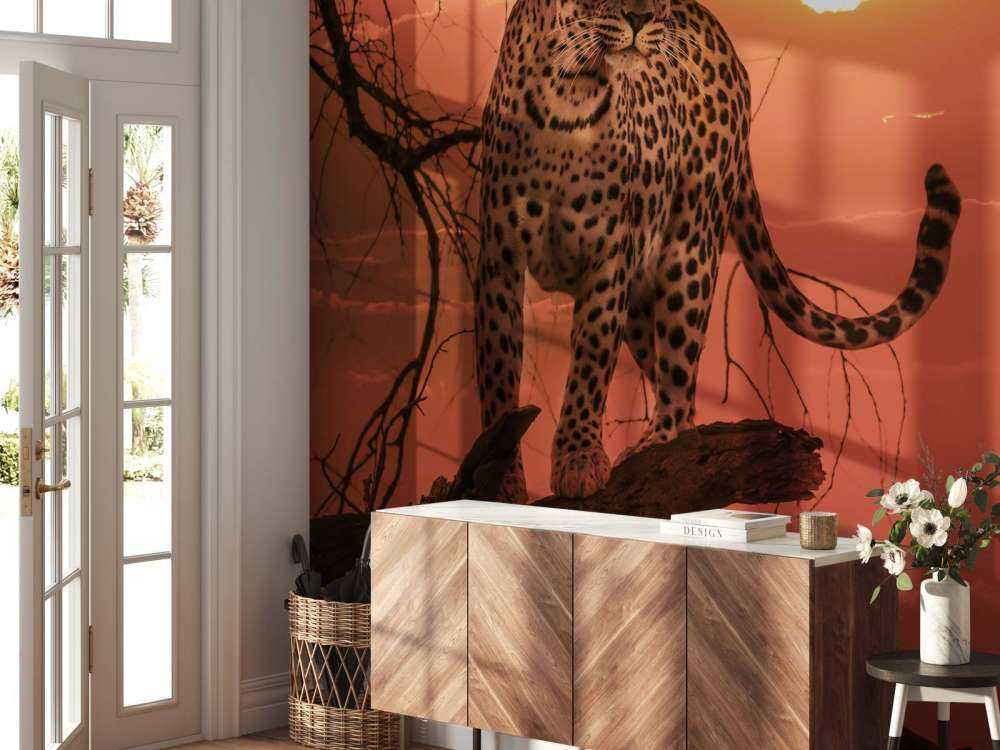 Leopard mit untergehender Sonne
